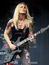 A person playing a guitar
Description automatically generated with medium confidence