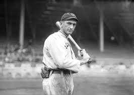 A baseball player holding a bat

Description automatically generated